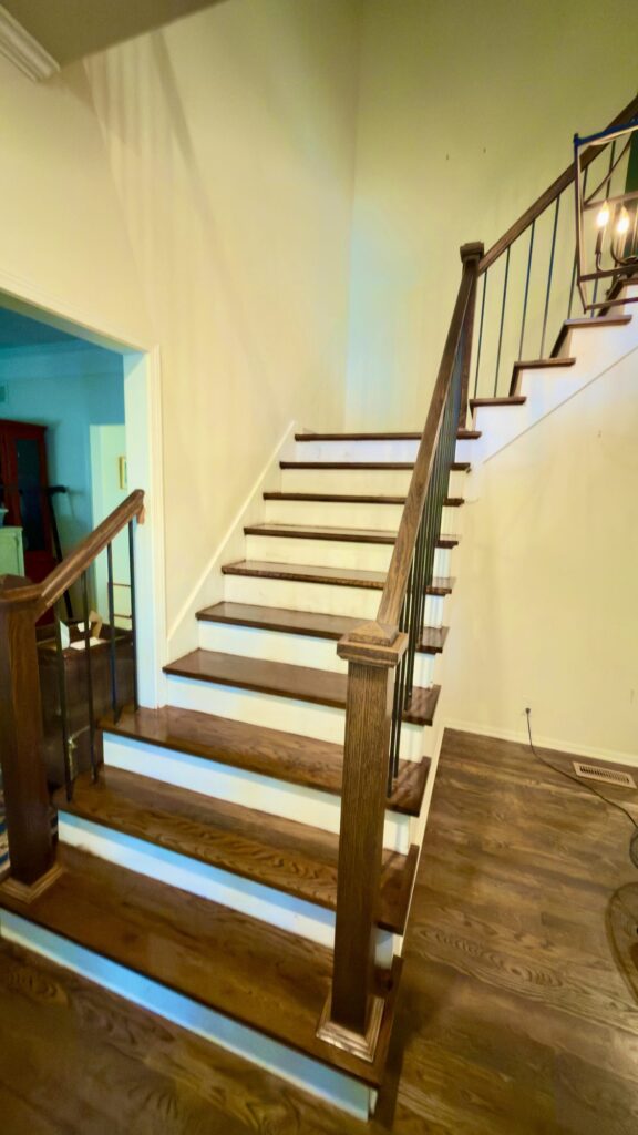 Custom Stairs: Stained treads, white risers and iron balusters