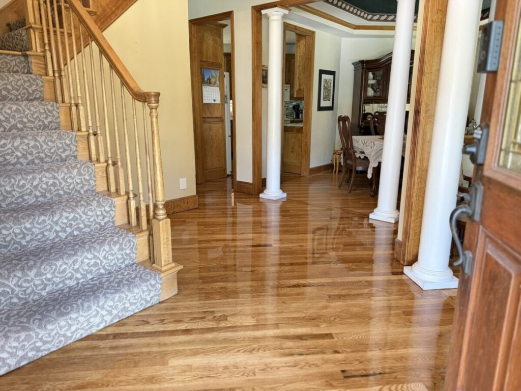 Stairs & Hardwood: Hardwood floors meeting a carpet-runner staircase
